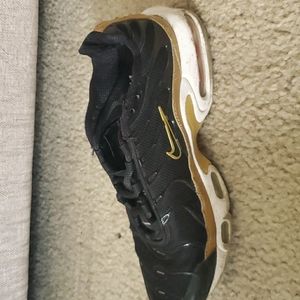 Black and gold  Nike sneakers